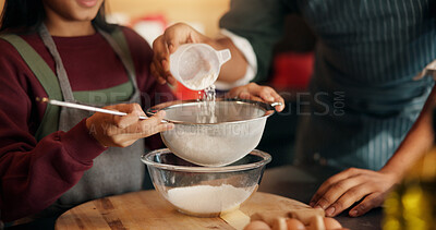 Buy stock photo Baking, flour and hands of child with parent in kitchen of home for development, help or tradition. Kid, learning and sieve utensil with family in apartment together for cooking or how to bake
