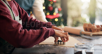 Buy stock photo Christmas, cookie cutter and hands of child with parent in kitchen of home for festive tradition. Baking, help and holidays with family at apartment together for cooking or learning in December