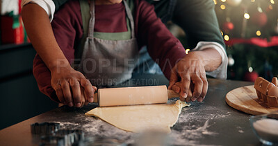 Buy stock photo Baking, Christmas and hands of child with parent in kitchen of home for festive tradition or help. Holidays, learning and rolling pin with family at apartment together for cooking in December season