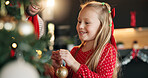 Christmas, father and girl with tree for decoration on festive holiday, family tradition or help. Child, man and together in home for celebration, happiness and xmas bauble for bonding in winter