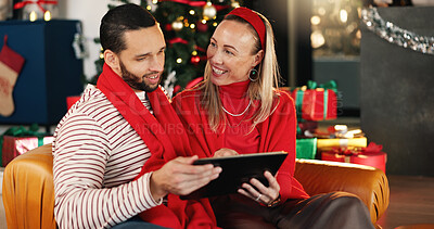Buy stock photo Christmas, tablet and smile with couple on sofa for online shopping, xmas discount and gift research. Holiday season, festive deals and relax with man and woman in living room of home for happiness