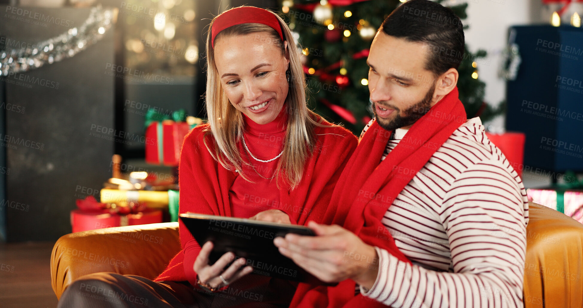 Buy stock photo Christmas, house and couple with tablet, love and search for gifts, holiday season and bonding together. Connection, festive and man with woman, tech and online entertainment with Xmas celebration