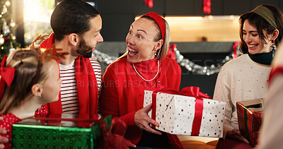 Buy stock photo Christmas, home and family in lounge, present and excited with smile, bonding together and festive. Group, apartment and Xmas with people, gifts and giving with happiness, holiday season or tradition