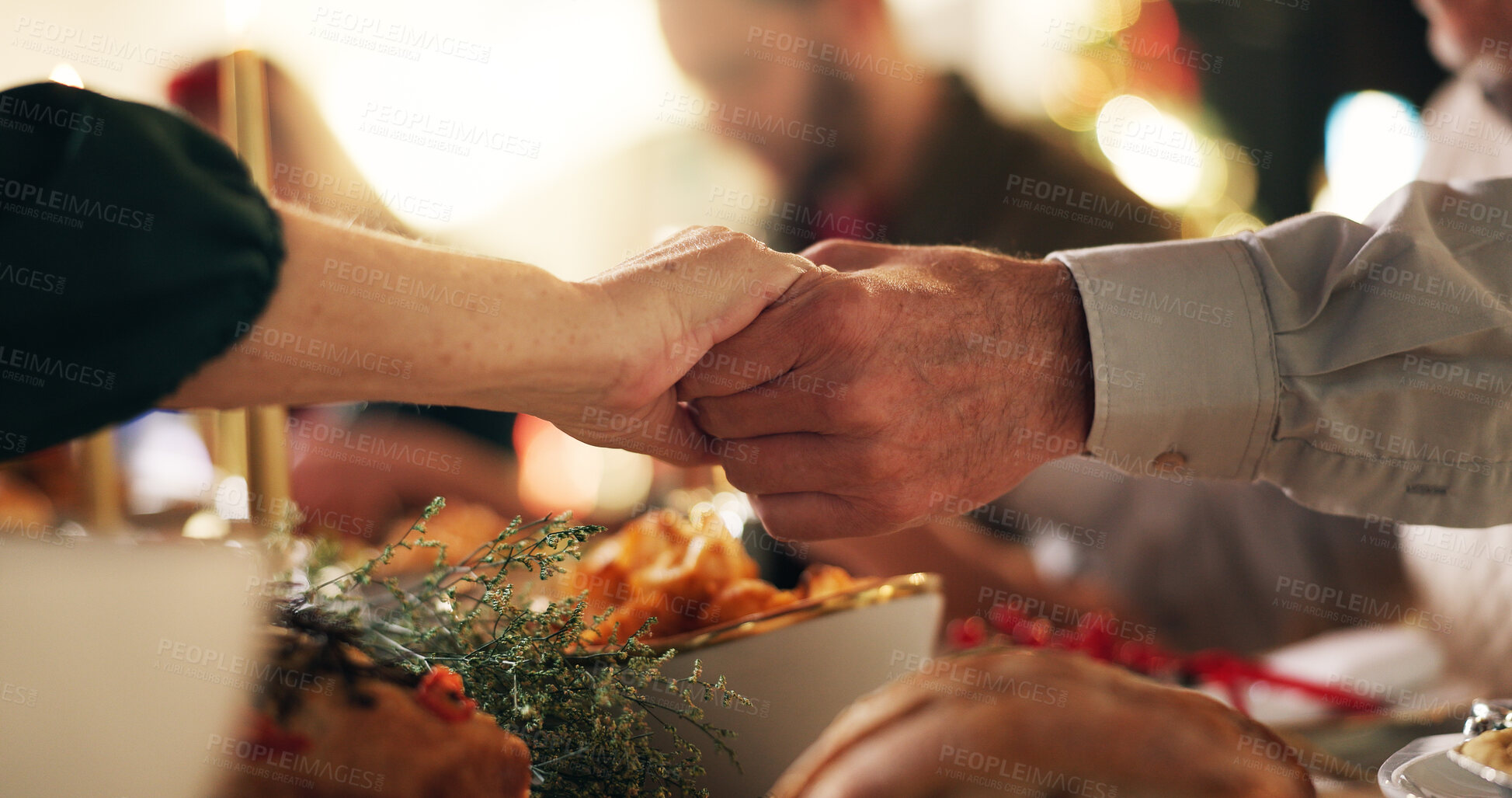 Buy stock photo Holding hands, Christmas and prayer with family at dinner table for gratitude, holiday season and love. Worship, spiritual and support with closeup of people in home for festive celebration and trust