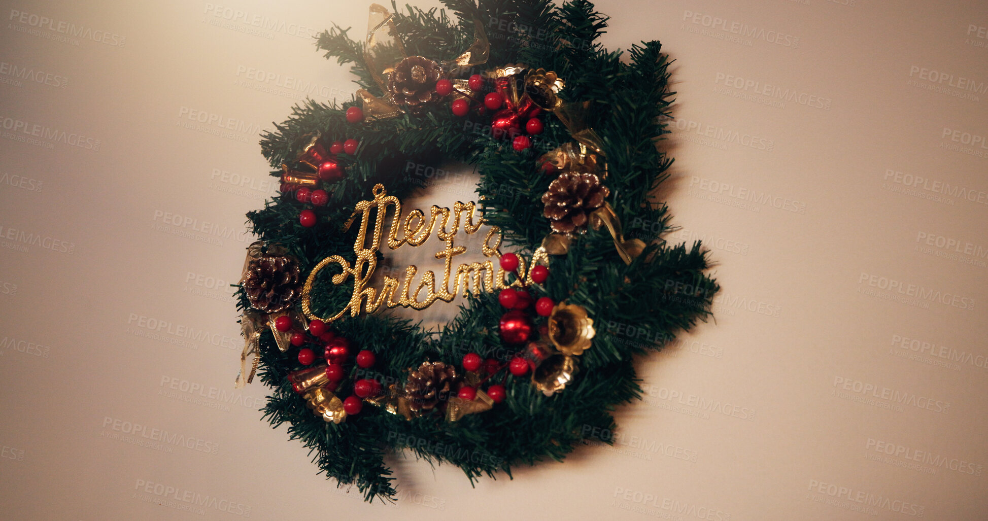 Buy stock photo Christmas, home or decor with wreath for festive holiday or celebration on a wall background. Empty, space and round hanging object with tinsel for merry december, new year or christian decorations