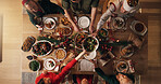 Festive, meal and people in home, reunion and celebration of Christmas with food at night or dinner. Above, group and family with feast for thanksgiving, evening and together on holiday in house