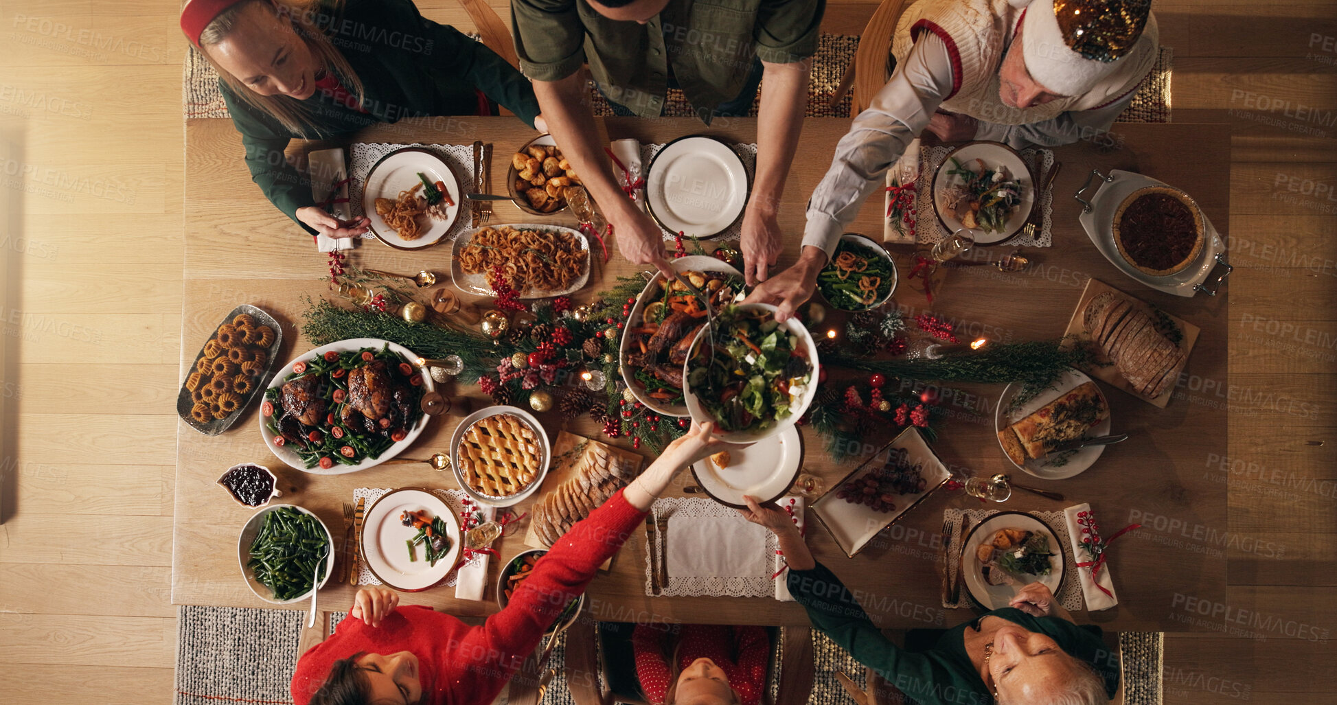 Buy stock photo Festive, meal and people in home, reunion and celebration of Christmas with food at night or dinner. Above, group and family with feast for thanksgiving, evening and together on holiday in house