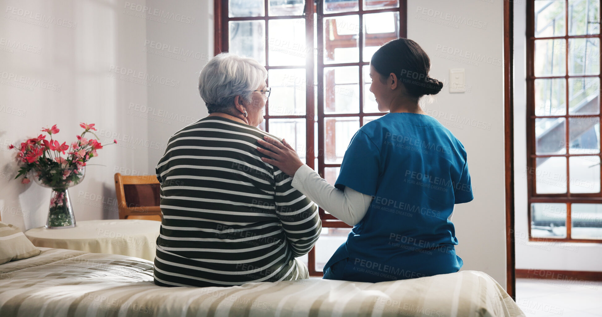 Buy stock photo Back, talking and nurse with senior woman in bedroom for support, help and care in nursing home. Retirement, healthcare and caregiver with elderly person for empathy, conversation and consulting
