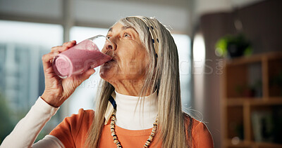 Buy stock photo Smoothie, drinking and mature woman in home for gut health, benefits and wellness in morning. Kitchen, diet and person with protein shake, cocktail and beverage for digestion, nutrition and detox