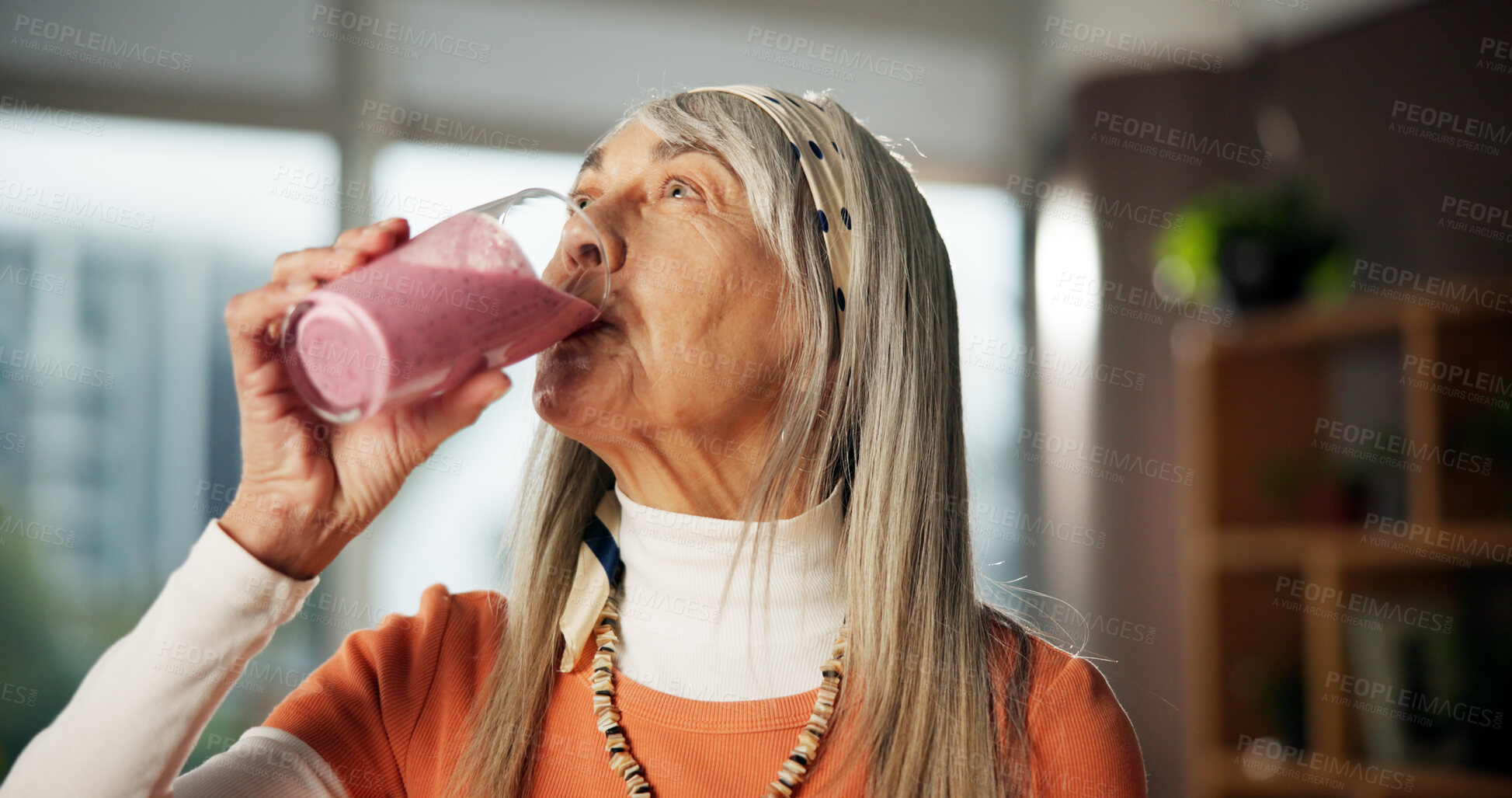 Buy stock photo Smoothie, drinking and mature woman in home for gut health, benefits and wellness in morning. Kitchen, diet and person with protein shake, cocktail and beverage for digestion, nutrition and detox