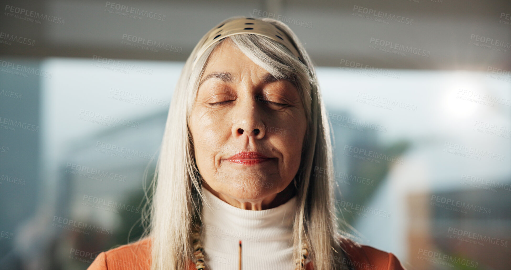 Buy stock photo Home, woman and smell aroma of incense stick for peaceful atmosphere, meditation and aromatherapy. Zen, mature person and inhale fragrance in house for holistic healing, self care and stress relief