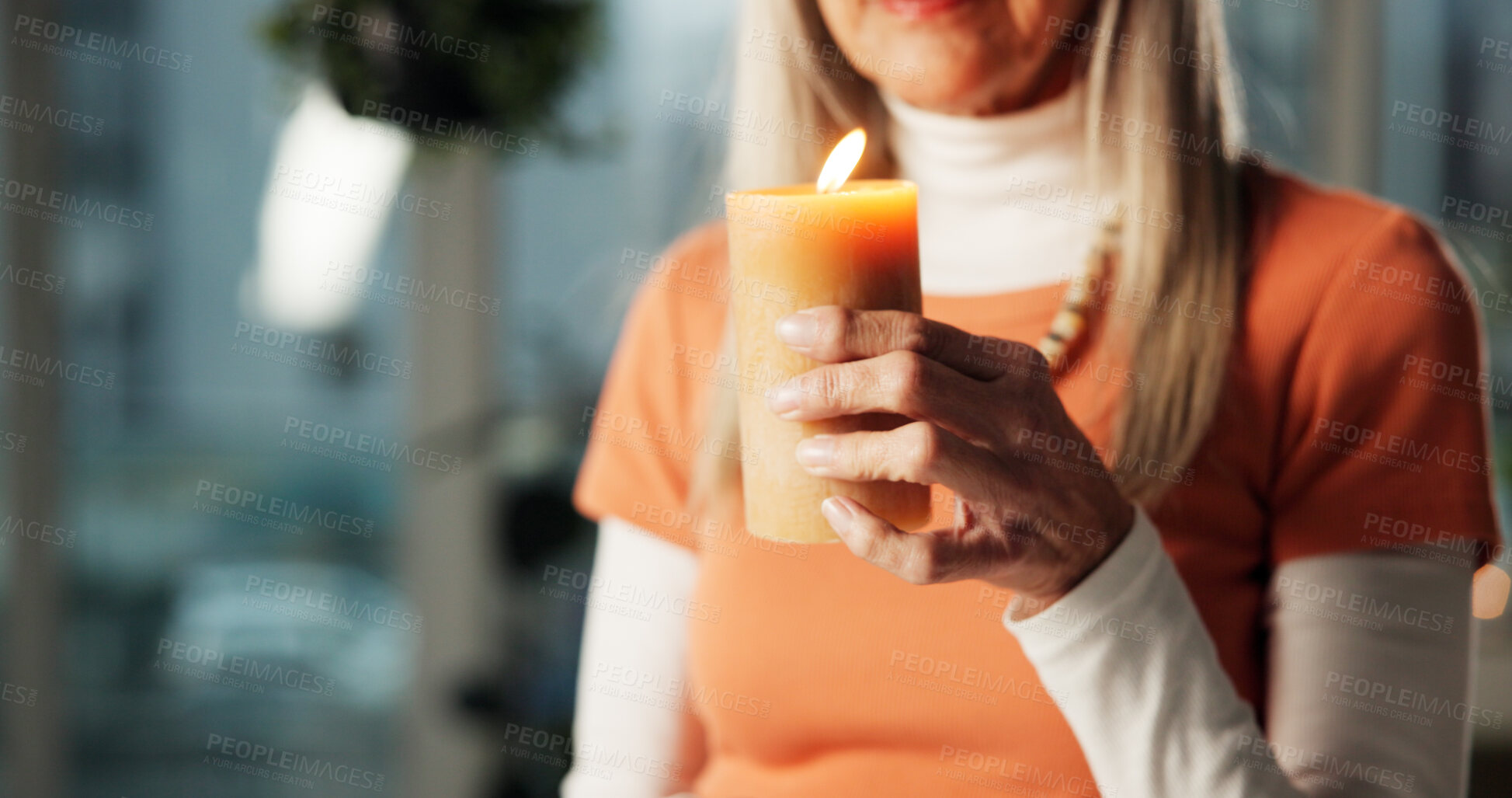 Buy stock photo Woman, hands and candle in home for aromatherapy, zen or scented wax for ambience with wellness. Atmosphere, light and senior person with flame for peace, calm or relax with holistic healing at night