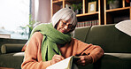 Senior woman, writing and diary on living room floor with reminder, notes and smile at retirement home. Person, book and happy for creativity, journal or relax with inspiration in lounge at apartment