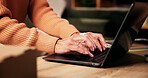 Woman, hands and typing on laptop for network, remote work or website update for small business. Mature entrepreneur, keyboard or tech in home for email draft, research or internet search for startup