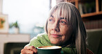 Old woman, coffee and smile with thinking on sofa for happy memory, daydreaming and weekend break. Retirement, relax and senior person with warm beverage in home for wellness and reflection in lounge