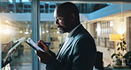 Writing, night and business black man on tablet for research notes, schedule and project management. Planning, corporate and worker on digital tech by glass for ideas, report and strategy in office