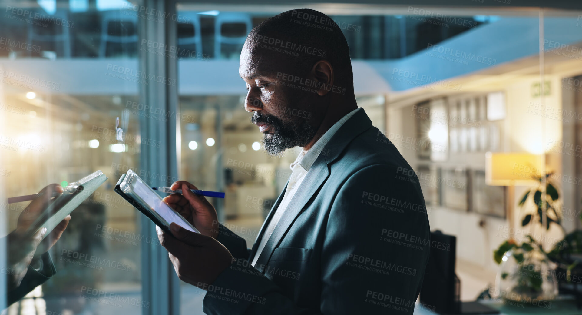 Buy stock photo Writing, night and business black man on tablet for research notes, schedule and project management. Planning, corporate and worker on digital tech by glass for ideas, report and strategy in office