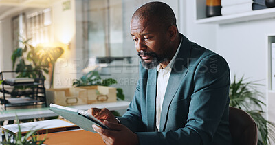 Buy stock photo Black man, tablet and reading in office for business, research or scroll on news website. Journalist, report and tech in agency for networking, article investigation or positive review on forum