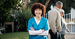 Happy, crossed arms and portrait of nurse outdoor for fresh air, wellness and relax at nursing home. Nature, backyard and confident woman with pride for assisted living, senior care or caregiver