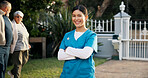 Happy, nurse and portrait of woman in garden with smile for fresh air, wellness or relax at nursing home. Nature, outdoor and confident person with pride for assisted living, senior care or caregiver