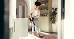 Cleaning, vacuum cleaner and carpet with woman in home for dust, hygiene and housekeeping chores. Sanitary, dirt prevention and germ protection with person and floor maintenance in apartment