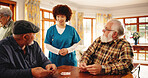 Elderly men, talk and nurse for playing cards of contest, friendly competition and hobby. Caregiver, chat and senior people with game for retirement entertainment, cognitive activity and nursing home