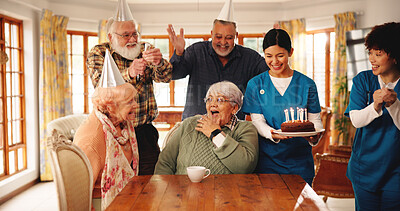 Buy stock photo Surprise, senior people and birthday cake in nursing home for celebration, laugh and excited. Special day, friends and shock at party event, wow and social gathering with medical team in retirement