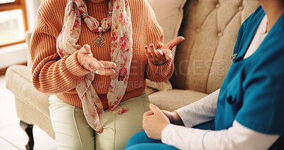 Buy stock photo Hands, nurse and senior person on sofa with conversation, healthcare assessment and support in retirement. People, caregiver and elderly patient on couch, consultation and explain symptoms in house