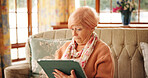 Home, watching and senior woman with tablet, facial expression or reaction to drama on web or online. Retirement, entertainment and elderly person with tech for movies, streaming and series in house