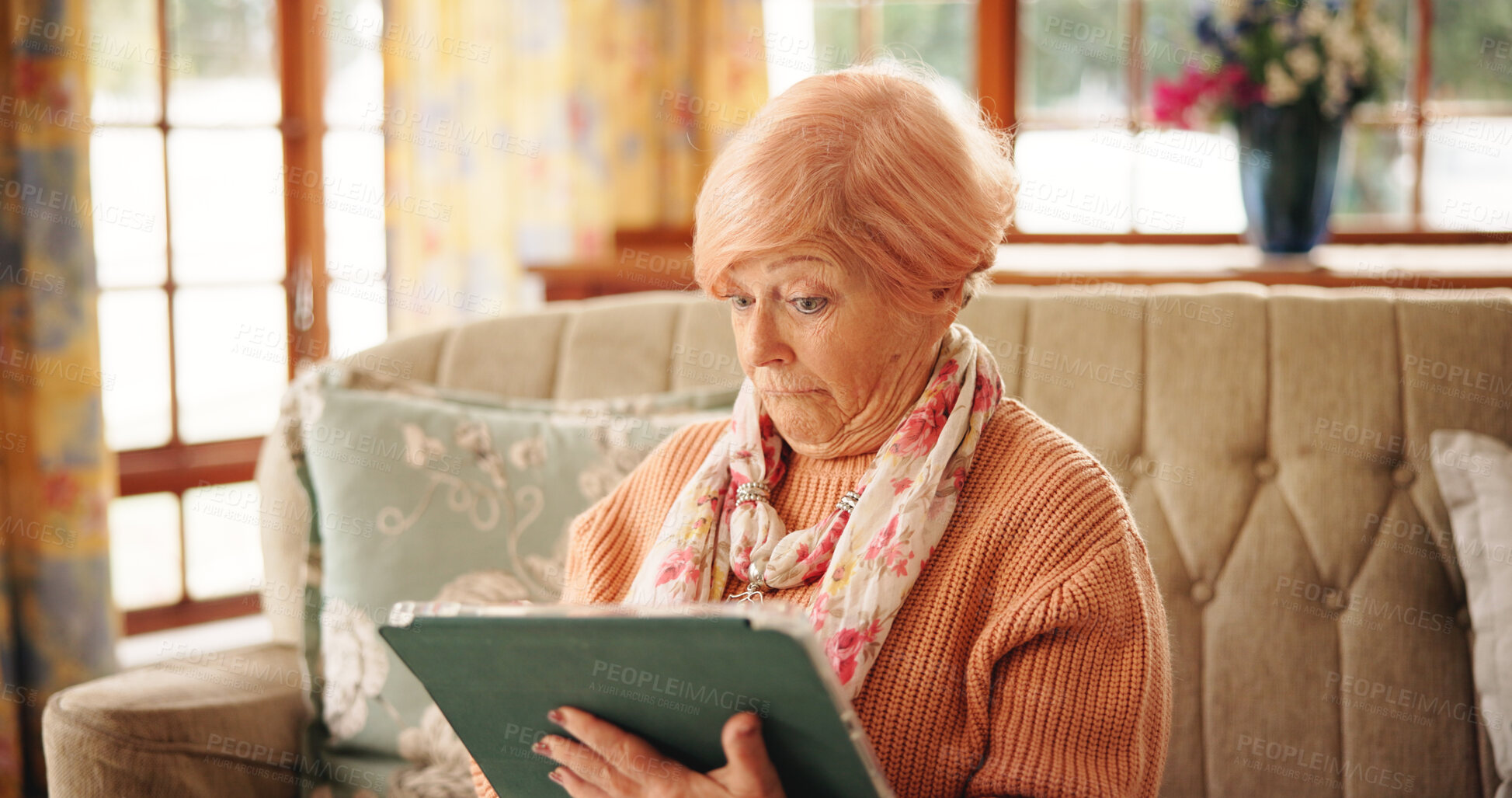 Buy stock photo Home, watching and senior woman with tablet, facial expression or reaction to drama on web or online. Retirement, entertainment and elderly person with tech for movies, streaming and series in house