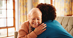 Senior woman, hug and sofa with nurse for thank you, assisted living or trust in retirement home. Female person, caregiver and embrace with elderly patient for healthcare or support in old age house