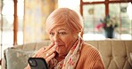 Senior woman, phone and shock on sofa for notification, gossip news or web chat in retirement home. Elderly person, smartphone and surprise with wow, story or mobile app for social media in house