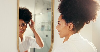 Buy stock photo Woman, hair check and mirror in  bathroom with texture, grooming and care for natural growth. Morning routine, haircare and African person with curl volume, reflection and smile for cosmetics