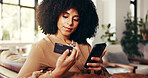 Credit card, phone and woman on couch with online shopping with sale, discount or promotion in home. Smartphone, debit and female person with mobile app, payment and internet retail in living room