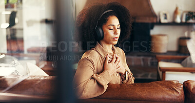Buy stock photo Meditation, music and woman with headphones in home for calm, peace and zen. Relax, mindfulness audio and African person listening to sound, podcast or streaming radio for self care in living room