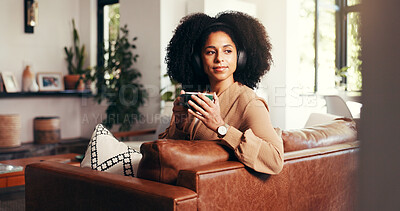 Buy stock photo Home, thinking and woman with coffee, headphones and relax with break, audio and live streaming. Apartment, headset and person on couch, radio and listening to music, daydreaming and sound with tea