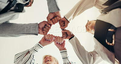 Buy stock photo Fist bump, low angle and business people at hands with team motivation, support and circle at agency. Group, huddle and goals at office with celebration, achievement or collaboration at company