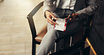 Hands, plane ticket and business person in lobby on travel, immigration or paperwork for flight pass. Corporate employee, booking info and relax with suitcase in airport lounge for international trip