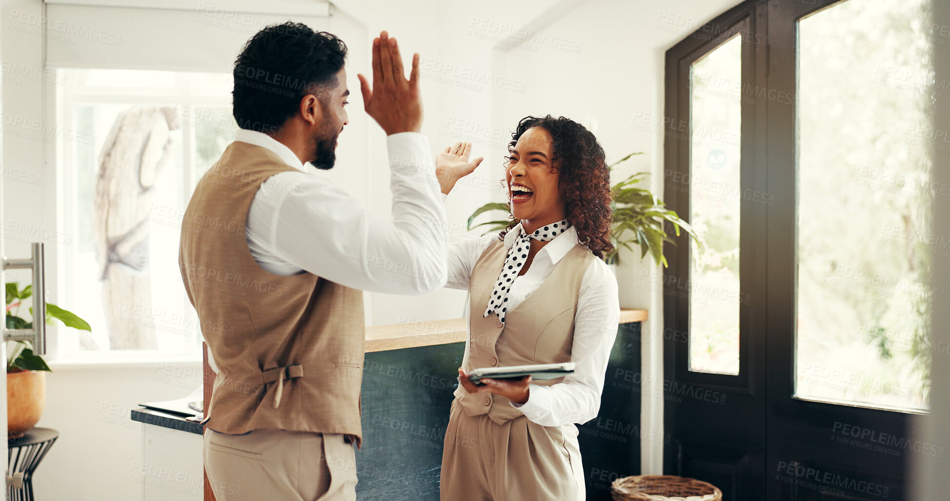 Buy stock photo Hospitality, high five and people at hotel reception for customer service, welcome or luxury accommodation. Tablet, concierge team and celebration in lobby for check in, success and booking goal