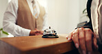 Customer, hands and concierge with service bell for request assistance or help in hotel. Closeup, client or people with alert on front desk for response, question or accommodation in luxury resort