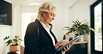 Business woman, tablet and lobby at hotel for trip schedule, contact and typing at luxury accommodation. Person, tech and scroll with app notification in hallway, travel and hospitality at lodge