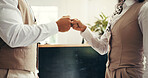 Fist bump, deal and business people in hotel for partnership, greeting or teamwork for meeting. Welcome, goal and front desk concierges with handshake for support, hospitality or collaboration.