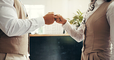 Buy stock photo Fist bump, greeting and business people in hotel for partnership, welcome or teamwork. Receptionist, customer service and front desk concierge with secret handshake for support in hospitality.