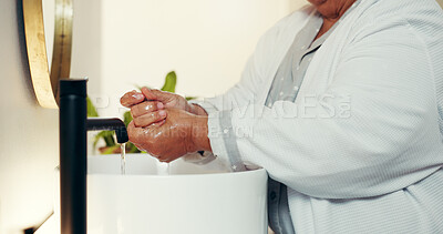 Buy stock photo Washing hands, hygiene and morning with old woman in bathroom for virus protection, wellness and skincare. Safety, health and bacteria prevention with person in home for water, self care and cleaning