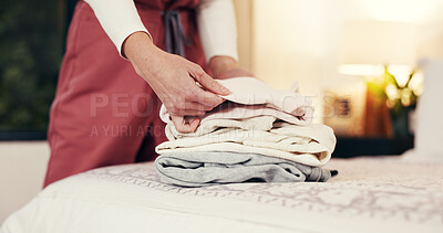 Buy stock photo Hands folding laundry, bed and house for hygiene routine, services and nurse in bedroom. Person, caregiver and packing clean clothes with garments, fabric or assisted living career at retirement home