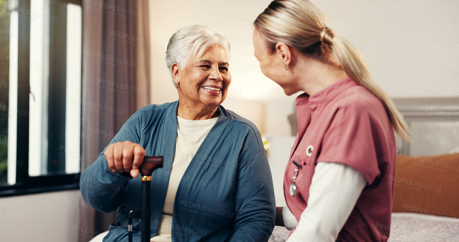 Buy stock photo Caregiver, senior woman and walking stick in nursing home for assisted living, homecare and help. Happy patient, nurse and talking in bedroom for healthcare, frail care and support in retirement