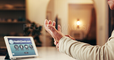 Buy stock photo Hand, wrist pain and senior person at house with symptoms of arthritis, carpal tunnel and injury. Elderly man, muscle sprain and tablet with nerve damage, joint inflammation and cramps for condition