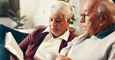 Buy stock photo Home, bible study and old couple on sofa, talking and religion with relationship, worship and reading. Support, gratitude and man with mature woman, faith and holy scripture with spiritual guide
