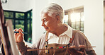 Elderly woman, creative and artist painting for craft, talent and art with sketch in home. Retirement hobby, painter and canvas for artwork, inspiration or senior person drawing with brush in house