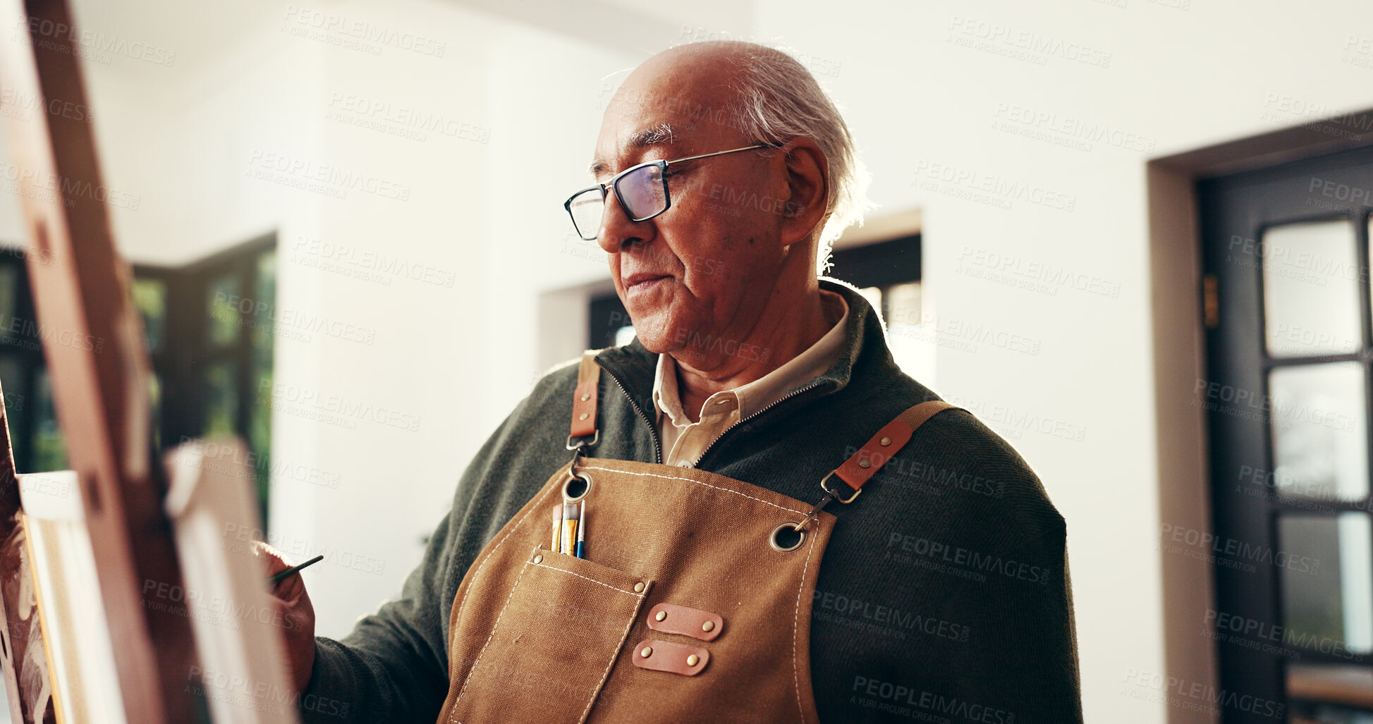 Buy stock photo Senior man, home and painting for creative self expression, talent and sketch with easel for art. Retirement hobby, artist and canvas for artwork, inspiration and elderly person drawing in house